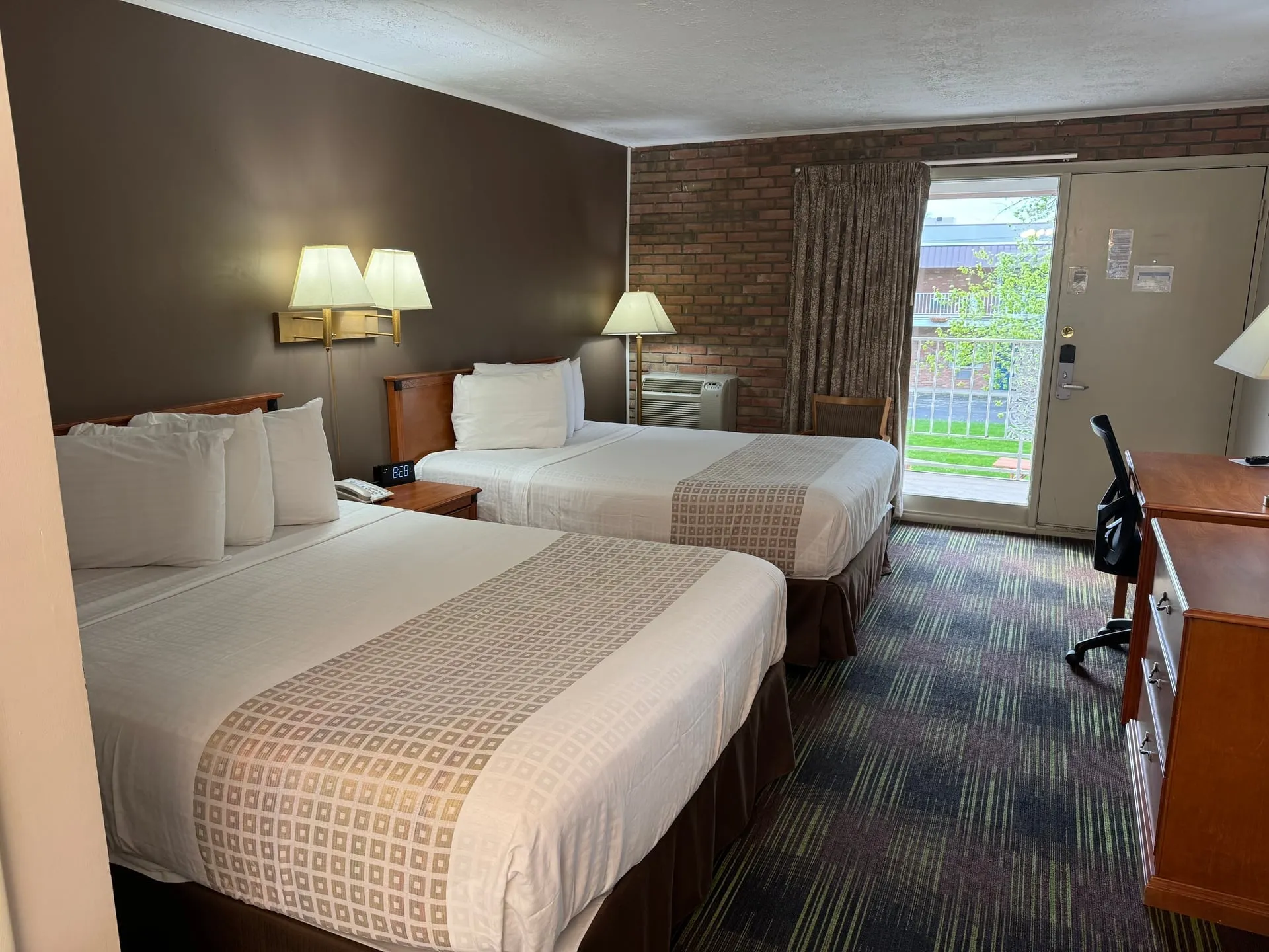 Comfortable queen bed room at South Shore Inn