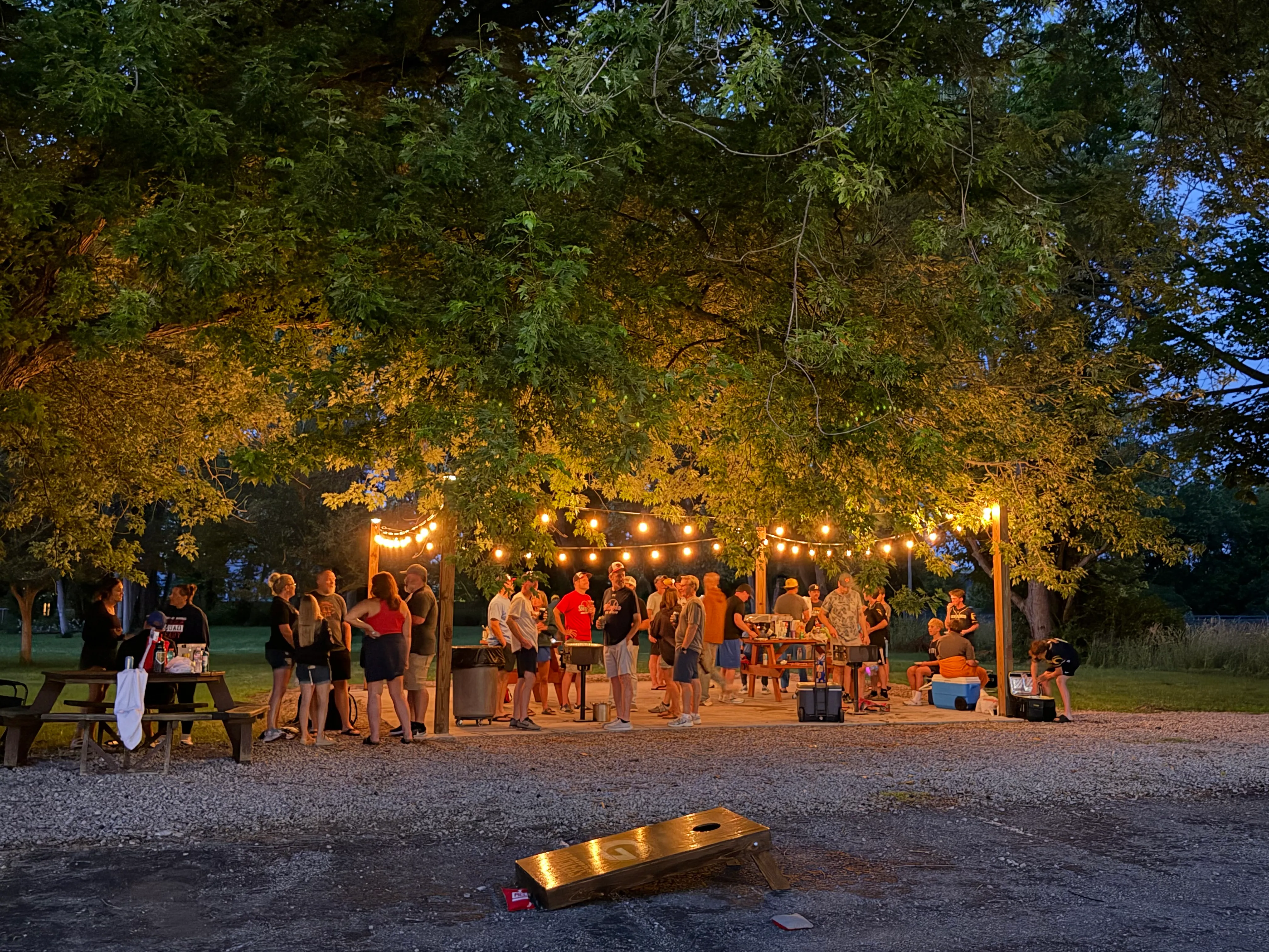 South Shore Inn BBQ patio area lit up with string lights on a summer evening